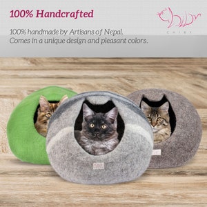 May include: Three felted cat beds in green, gray, and brown with cats inside. The beds are 100% handcrafted by artisans in Nepal. The text "100% Handcrafted" and "100% handmade by Artisans of Nepal. Comes in a unique design and pleasant colors." is visible at the top of the image.