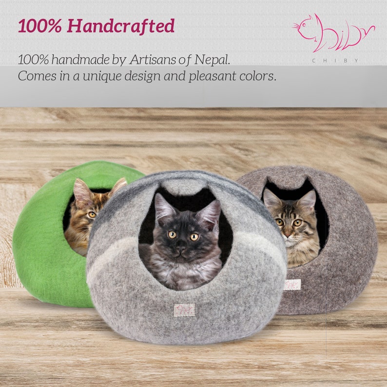 May include: Three felted cat beds in green, gray, and brown with cats inside. The beds are 100% handcrafted by artisans in Nepal. The text "100% Handcrafted" and "100% handmade by Artisans of Nepal. Comes in a unique design and pleasant colors." is visible at the top of the image.