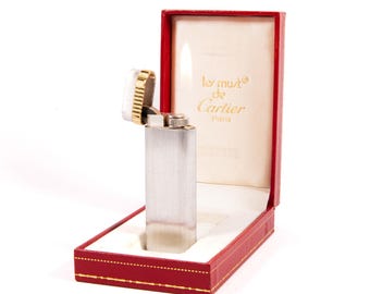 Encendedor vintage plateado Cartier Les Must en caja, década de 1970