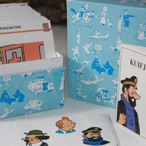 Enciclopedia de Tintín | Índice de tarjetas | Juego de preguntas y respuestas | Libro de referencia de Tintín | Caja de cartas de la Enciclopedia de Tintín | Tintín | Capitán eglefino