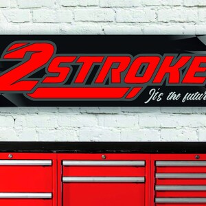 May include: A black and red banner with the text "2STROKE" in red and "It's the future" in white. The banner has a checkered pattern in the background.