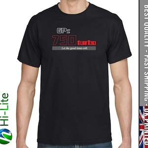May include: Black t-shirt featuring a white graphic of a motorcycle engine. The graphic reads "GPz 750 turbo" and "Let the good times roll."