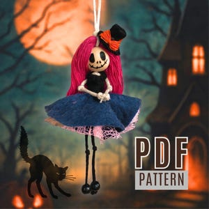 May include: A handmade Halloween doll with a skeleton face, pink hair, and a black top hat with an orange ribbon. The doll wears a blue skirt with a pink lace trim and has long black legs. A black cat silhouette is in the foreground.
