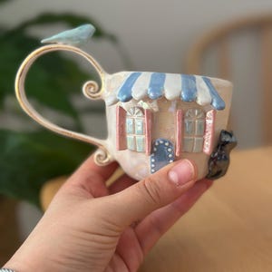 Handmade Ceramic House Mug, Black Cat Coffee Cup, 24K Gold Handle, Iridescent Lustre Glaze, Blue Striped Awning, Artisan Pottery, 125ml