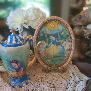 Snow White tea pot & oval tray hand painted, crackled and adorned with light blue gems and rhinestones. Hand painted, decopauged silver set