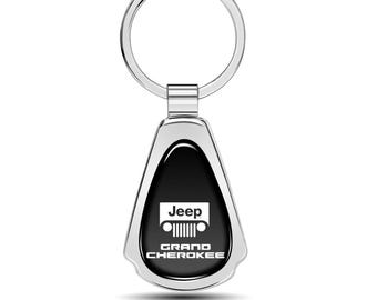Imagen de iPick para llavero de metal cromado con forma de lágrima y cúpula negra para Jeep Grand Cherokee, con licencia oficial