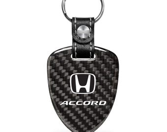 Imagen de iPick para el llavero grande estilo escudo de fibra de carbono negro auténtico del Honda Accord, con licencia oficial.