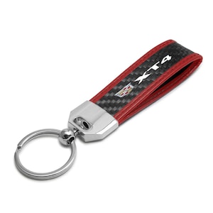 iPick Image for Cadillac XT4 Logo Real Carbon Fiber Strap with Red Leather Stitching Edge Key Chain, Official Licensed