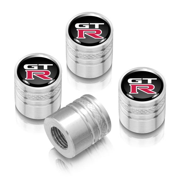thumbnail interactive-video image 1 of Nissan Black On Black Aluminum Tire Valve Stem Caps – Cylinder Style, New Logo, Set Of 4 1 of 4