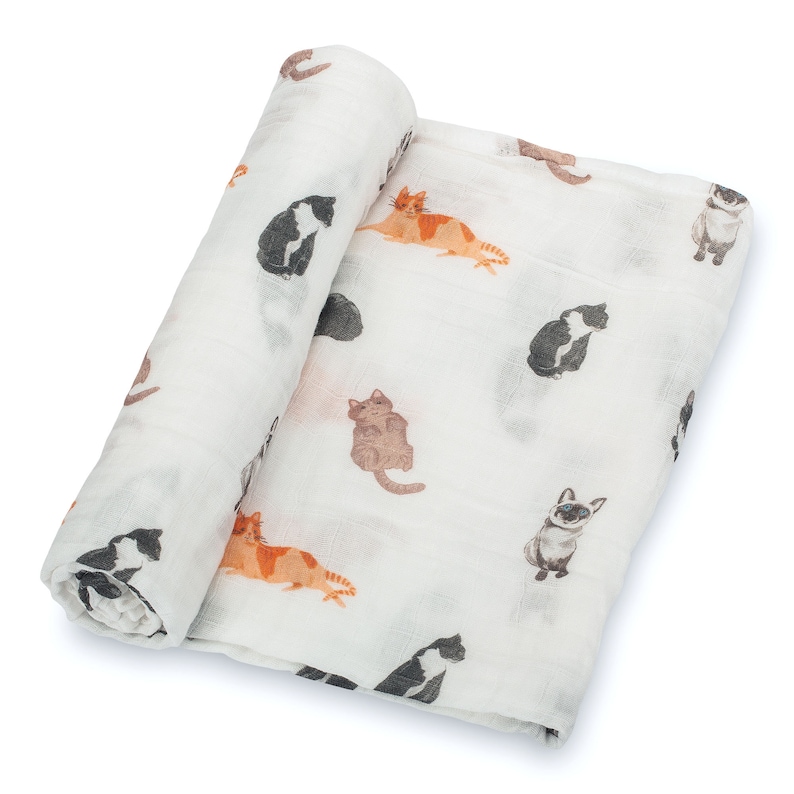 Adorable baby cat print muslin swaddle blanket, a soft and cozy essential for your little one.