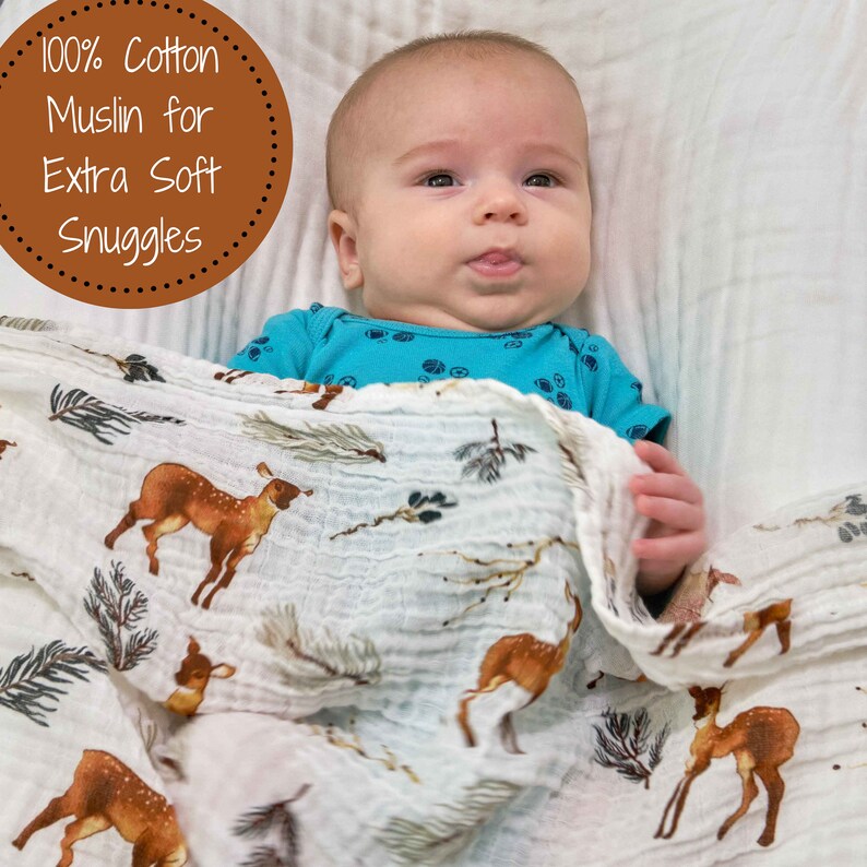 Organic bamboo baby swaddle, showcasing an elegant deer motif in soothing earth tones, perfect for sensitive baby skin.