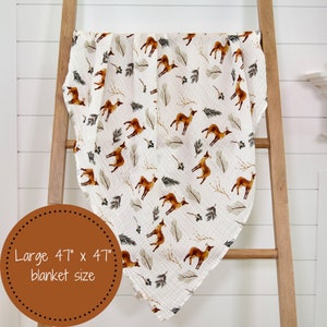 Lightweight and stretchy swaddle blanket with a cute deer illustration, ensuring a snug yet comfortable fit for all-day comfort.