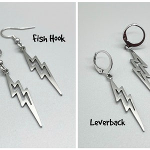 May include: Two pairs of silver lightning bolt earrings. The first pair has fish hook closures. The second pair has leverback closures. The text "Fish Hook" and "Leverback" are written below each pair of earrings.