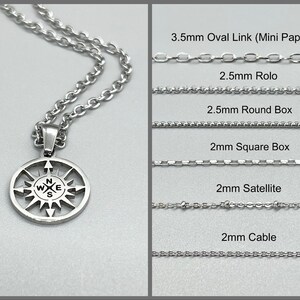 May include: A silver compass pendant necklace with a variety of silver chain styles, including 3.5mm oval link, 2.5mm rolo, 2.5mm round box, 2mm square box, 2mm satellite, and 2mm cable.