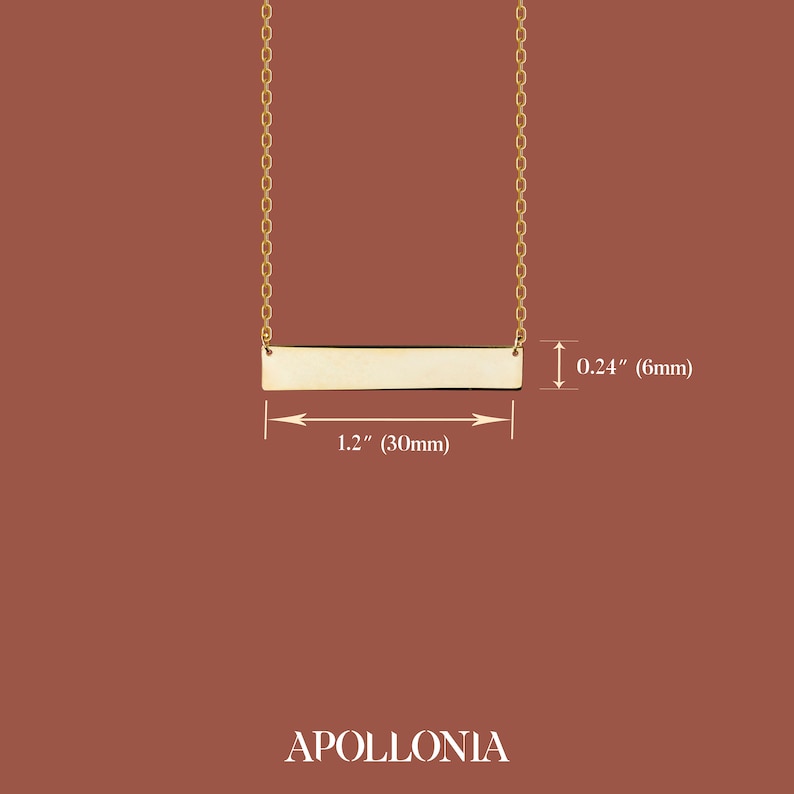 May include: Gold bar necklace with a 1.2 inch (30mm) long bar and a 0.24 inch (6mm) width. The necklace is made of gold chain.