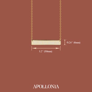 May include: Gold necklace with a bar pendant engraved with the coordinates 37&deg; 35' 51 2844" N. The bar is 1.2 inches long and 0.24 inches wide.