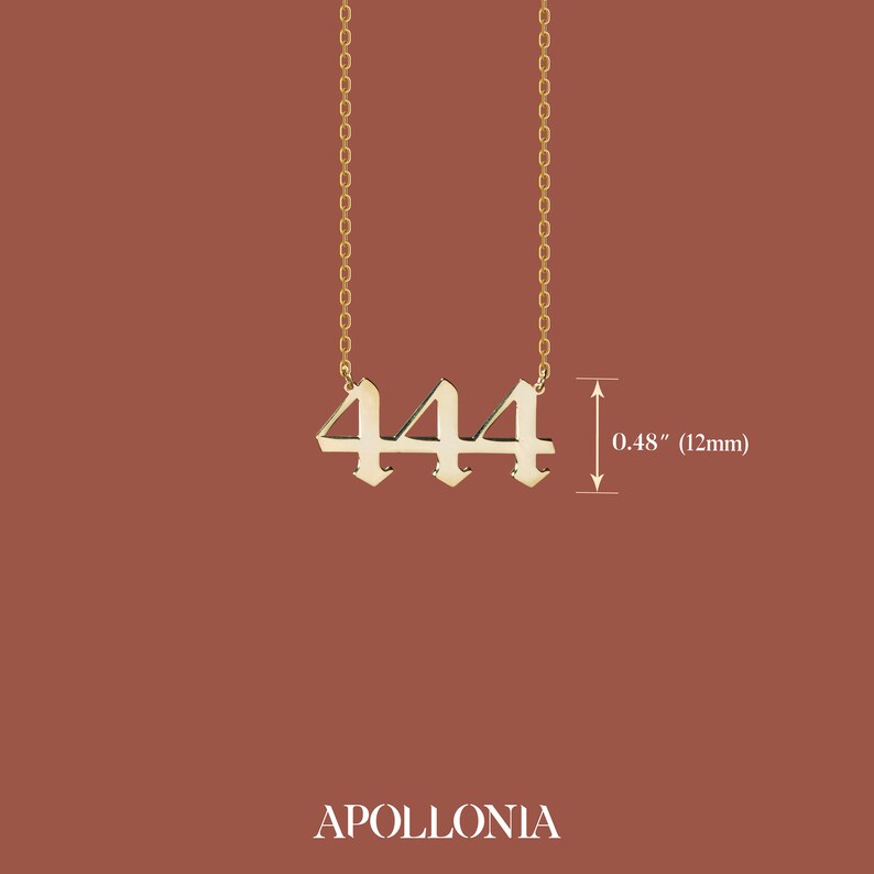 May include: Gold necklace with a pendant featuring the number 444 in a gothic font. The pendant is 0.48 inches (12 mm) tall.