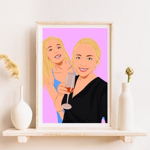 May include: A framed illustration of two women with blonde hair, one holding a glass of wine. The background is a light pink color.