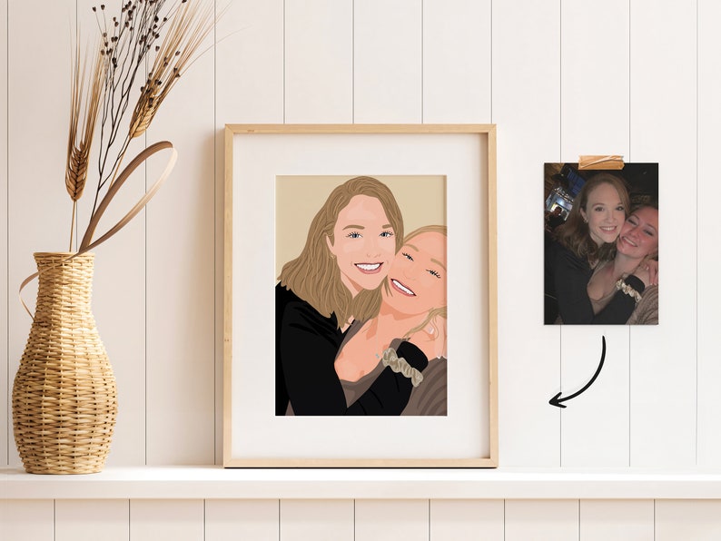May include: A framed illustration of two women smiling and hugging. The illustration is in a simple style with brown hair and black and brown clothing.