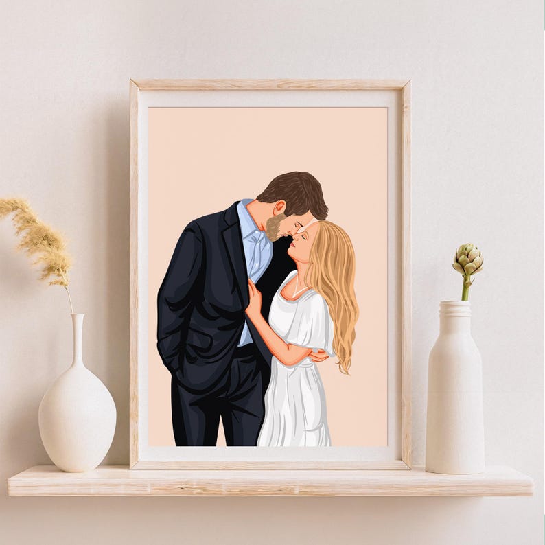 May include: A framed illustration of a couple embracing. The man wears a black suit and the woman is in a white dress. The background is a soft peach color. The artwork is displayed on a white shelf with decorative vases.