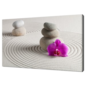 May include: A zen garden scene with stacked gray stones and a pink orchid on white sand with concentric circles.