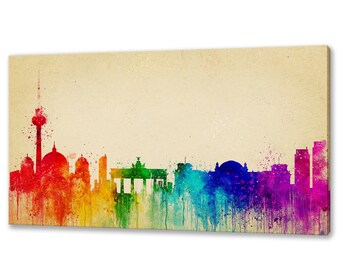 May include: A watercolor painting of the Berlin skyline in rainbow colors. The painting is on a beige background.