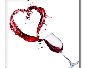 May include: A red wine splash forming a heart shape as it pours from a glass.