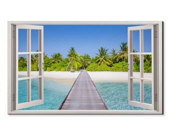 May include: A white window frame with a view of a tropical beach with palm trees and a wooden walkway leading to a small island. The water is a clear turquoise color.