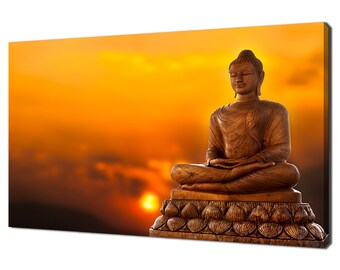 May include: A golden Buddha statue sits in meditation pose on a lotus base against a sunset backdrop. The statue is carved with intricate details and has a serene expression.