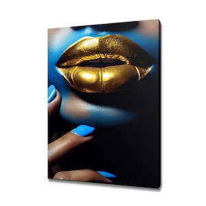 May include: Close-up of a person's lips with gold lipstick and blue nail polish.