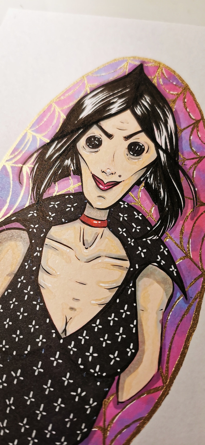 May include: A hand-drawn illustration of a woman with large eyes and a wide smile. She is wearing a black dress with a white pattern and a red choker. The background is a purple and gold swirl with a spiderweb pattern.