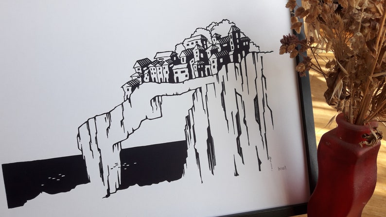 May include: Black and white illustration of a village perched on a cliff overlooking the sea. The village is made up of several small houses with windows and doors. The cliff is tall and rocky, with a large archway at the bottom. The sea is dark and choppy, with a few small birds flying over the water.
