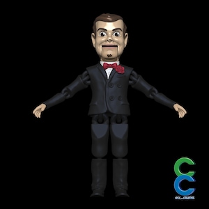 May include: A ventriloquist dummy toy with a painted face, brown hair, and a black suit. The dummy has a red bow tie and a red rose on the lapel. The arms and legs are articulated, and the dummy is posed with arms outstretched.