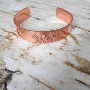 May include: A rustic wooden sign with the text "Welcome to our home" in white lettering. The sign features a distressed finish and a simple, inviting design, perfect for entryway decor.