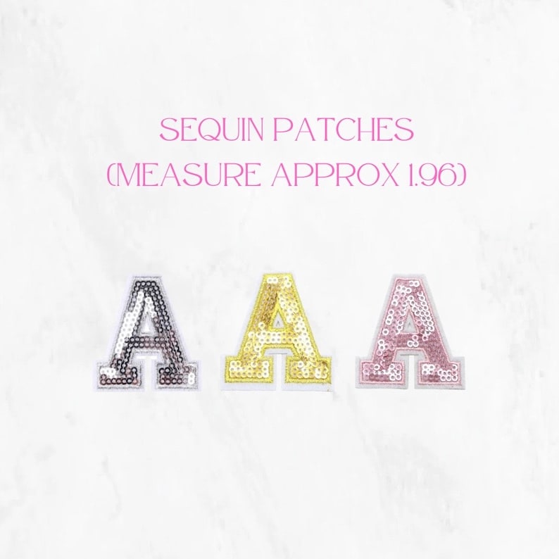 May include: Three sequin patches in the shape of the letter "A". The patches are silver, gold, and pink. The text "SEQUIN PATCHES (MEASURE APPROX 1.96)" is above the patches.