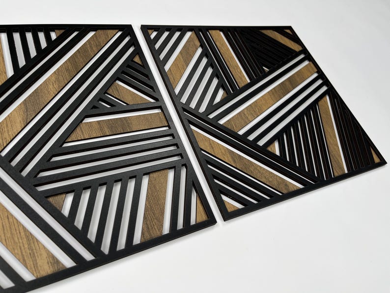 May include: Two black geometric wall panels with a wood grain pattern. The panels are made of wood and have a modern design.