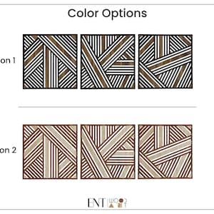 May include: Two options for a geometric wood wall art piece. Option 1 features black and white stripes. Option 2 features brown and white stripes.