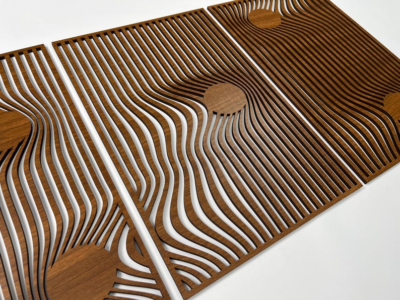 May include: Three wooden panels with a repeating wave pattern and circular accents. The panels are made of a warm brown wood, with the wave pattern creating a sense of depth and movement. The design is modern and abstract.