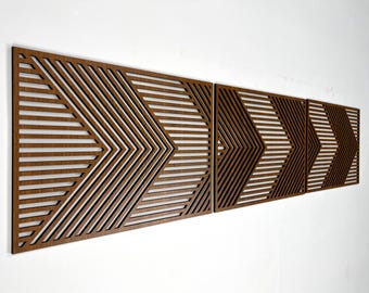 May include: A set of three brown wooden wall panels with a geometric pattern of overlapping lines creating a chevron design.