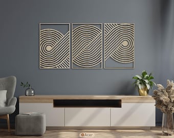 May include: Three-piece wall art set featuring a repeating, curved line design in a natural wood finish. Each piece is framed and mounted on a gray background. The artwork is displayed above a modern white and wood-tone cabinet.