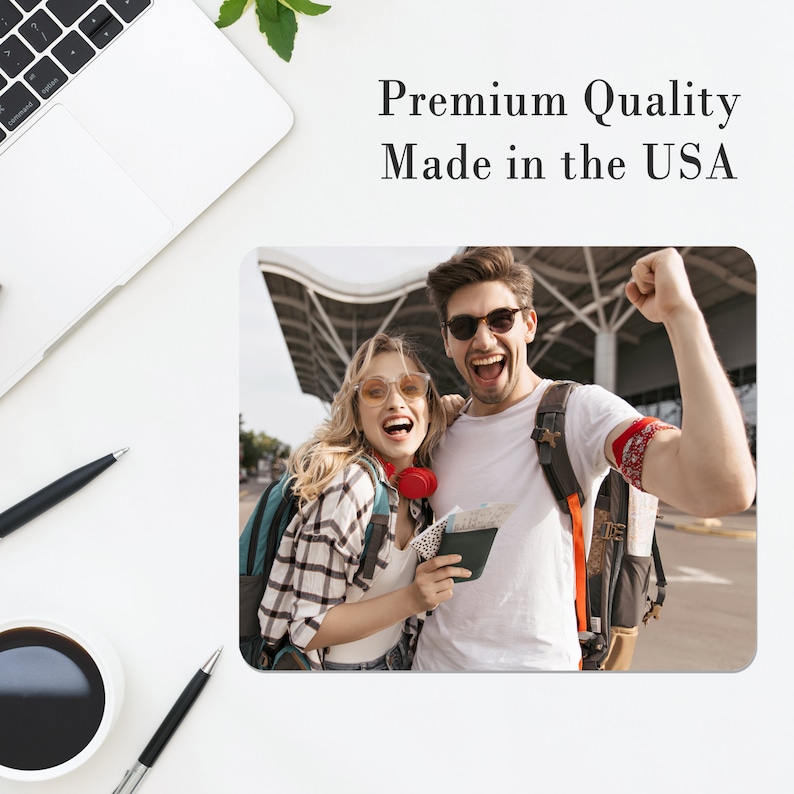 May include: A couple wearing sunglasses and backpacks stand in front of an airport terminal. The woman is wearing a plaid shirt and the man is wearing a white t-shirt. They are both smiling and looking at the camera. The man is holding a passport and tickets.