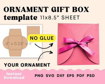 May include: A printable template for a gift box that can hold an ornament. The template is for an 11 by 8.5 inch sheet of paper. The template is shown next to a pink gift box with a pink ribbon. The text "NO GLUE" is on the template. The text "ORNAMENT GIFT BOX template 11x8.5" SHEET" is at the top of the image. The text "YOUR ORNAMENT" is below the template. The text "Instant Download PNG SVG DXF EPS PDF PSD" is at the bottom of the image.