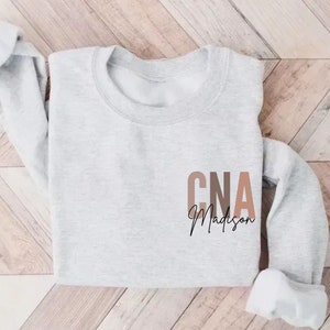 CNA Sweatshirt, Custom CNA Gift for Certified Nursing Assistant Crewneck, Personalized CNA Nurse Pullover, Cna Nurse Appreciation Sweater