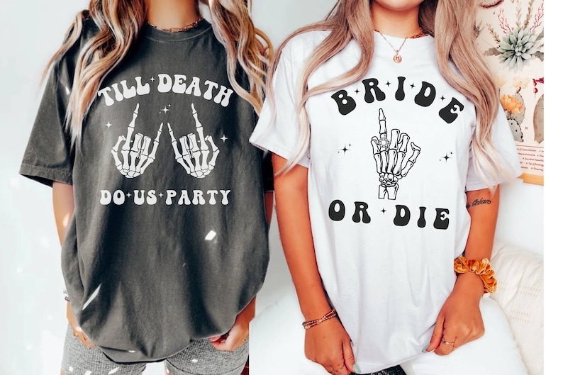 May include: Two t-shirts with a skeleton hand graphic and text. The first shirt is dark gray with the text "Till Death Do Us Party". The second shirt is white with the text "Bride or Die".