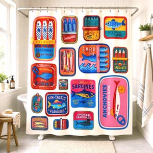 May include: A white shower curtain featuring a colorful pattern of various rectangular sardine and anchovy tin labels. The graphic designs include illustrations of fish, waves, and text such as Sardinhas em tomate, Original Sardines, and Fin-tastic Flavours in vibrant shades of red, blue, yellow, and pink.