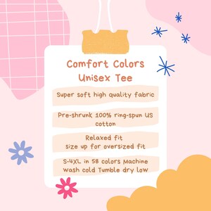 May include: A white rectangular sign with a yellow clip at the top, featuring the text Comfort Colors Unisex Tee, Super soft high quality fabric, Pre-shrunk 100% ring-spun US cotton, Relaxed fit size up for oversized fit, S-4XL in 58 colors Machine wash cold Tumble dry low.