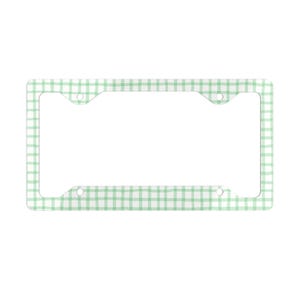 May include: A license plate frame with a light green and white gingham pattern. The frame has a rectangular shape with rounded corners and several mounting holes.