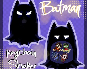 May include: A purple background with a black Batman-shaped keychain shaker. The keychain has a cutout revealing four cartoon characters. The words "Batman" and "Keychain Shaker" are written in a stylized font.
