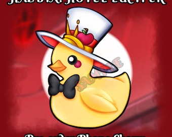 May include: A yellow rubber ducky wearing a red and white top hat with a crown and an apple on top. The ducky is wearing a black bow tie and the text "Pre-order Phone Charm" is below the ducky. The background is red.