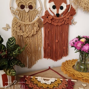 Yellow Macrame Owl and Red Macrame Fox are hanging on the wall between the flowers. Warm colors version of Macrame Leaf Half Mandala is laying on the table.
On the left is logo of Poly Tusal Handmade.